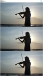 美女海边拉小提琴剪影
