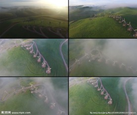 航拍绿色山头的风能发电风车