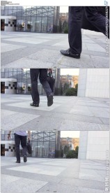 穿着皮鞋提着电脑包的男人行走上