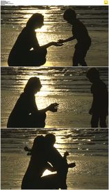 金色阳光海滩母子剪影