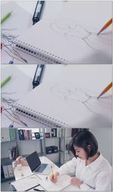 美女服装设计师画草图