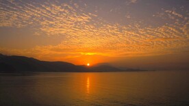 大海海边清晨日出风光4K航拍视